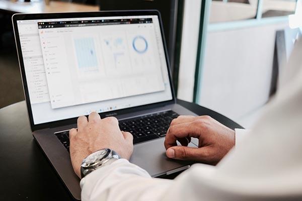 Man typing on laptop