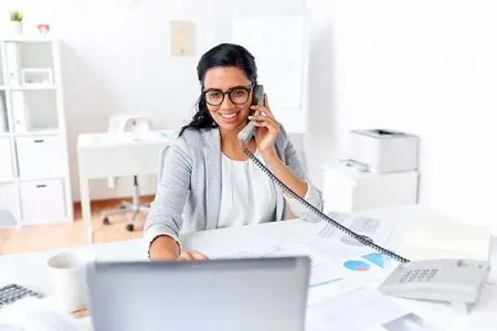 womanOnPhone Woman on the phone in the office